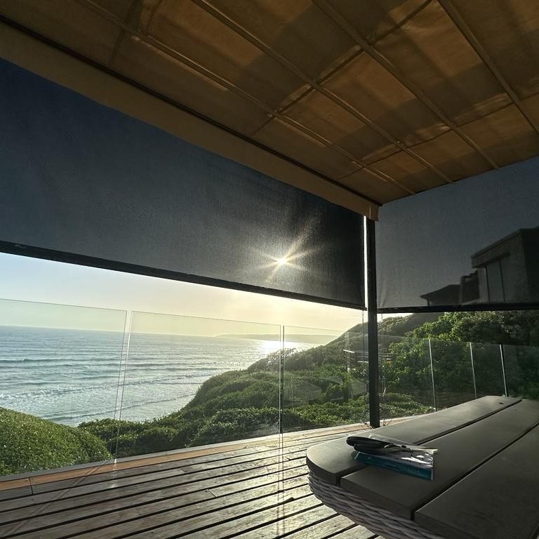 Pergola Awning Outdoor Roller Blind installed in Wilderness with Sunset View over the Sea Ocean